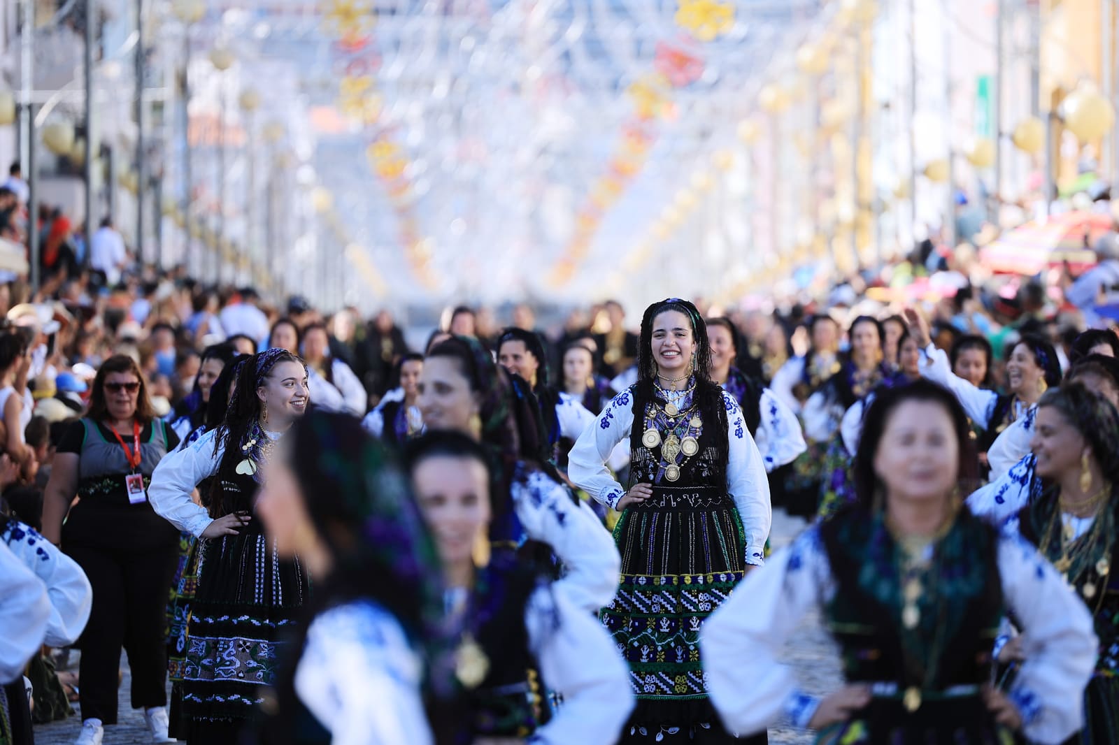 Portuguese women wearing traditional gold attached costumes take part in the annual parade of Our Lady Of Agony (Agonia) Pilgrimage in Viana do Castelo, Portugal, 16 August 2024. The pilgrimage dates back to the 18th century and is celebrated on the weekend after 15 August. The gold adorning the costumes has an overall value of several million euros. ESTELA SILVA/LUSA