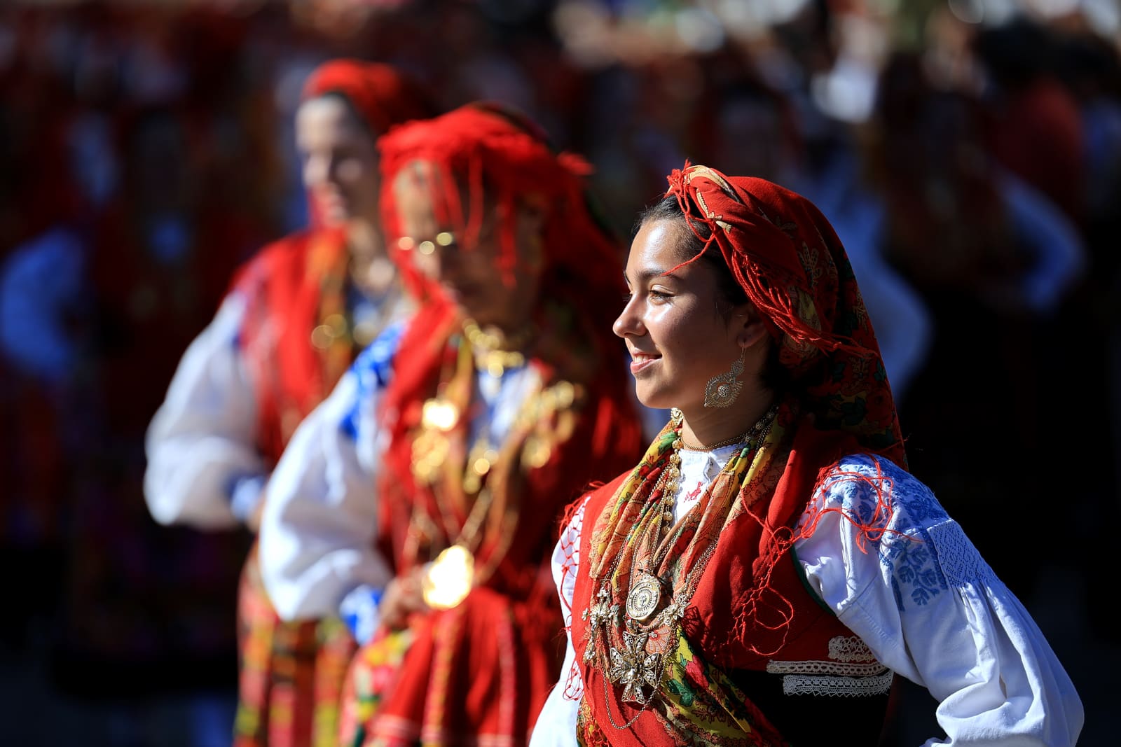 Portuguese women wearing traditional gold attached costumes take part in the annual parade of Our Lady Of Agony (Agonia) Pilgrimage in Viana do Castelo, Portugal, 16 August 2024. The pilgrimage dates back to the 18th century and is celebrated on the weekend after 15 August. The gold adorning the costumes has an overall value of several million euros. ESTELA SILVA/LUSA