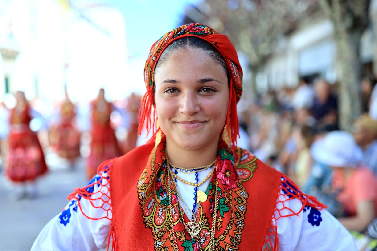 Portuguese woman wearing traditional gold attached costumes takes part in the annual parade of Our Lady Of Agony (Agonia) Pilgrimage in Viana do Castelo, Portugal, 16 August 2024. The pilgrimage dates back to the 18th century and is celebrated on the weekend after 15 August. The gold adorning the costumes has an overall value of several million euros. ESTELA SILVA/LUSA